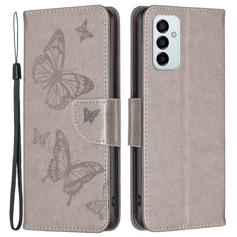 Flip Case Für Samsung Galaxy M23 5G Mit Kordel Riemchen Mit Schmetterlingen-print