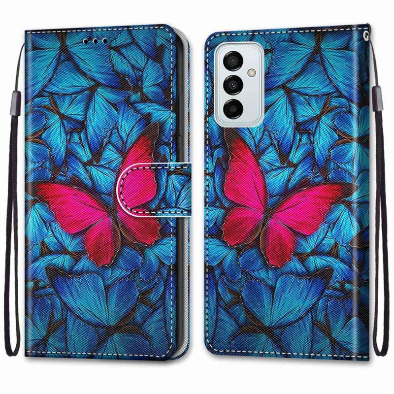 Lederhüllen Für Samsung Galaxy M23 5G Roter Schmetterling. Blauer Hintergrund