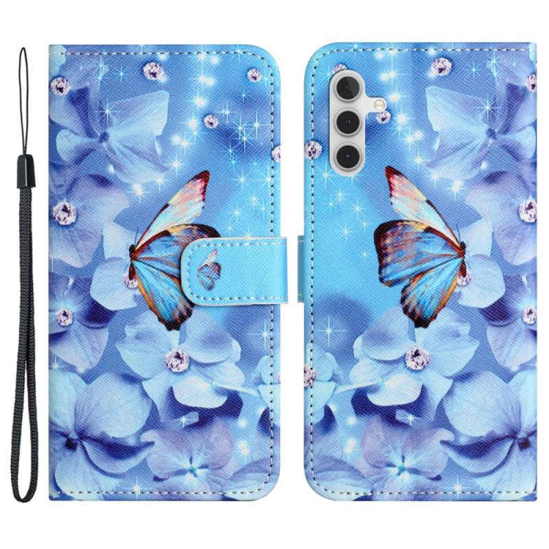 Lederhüllen Samsung Galaxy S24 Fe Blaue Blumen Und Schmetterlinge Mit Riemen