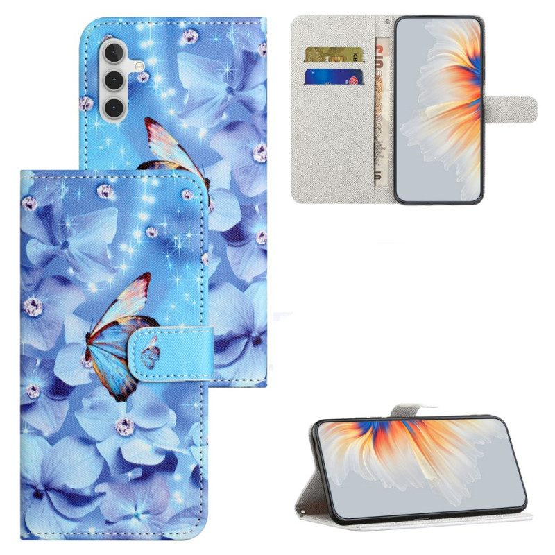 Lederhüllen Samsung Galaxy S24 Fe Blaue Blumen Und Schmetterlinge Mit Riemen