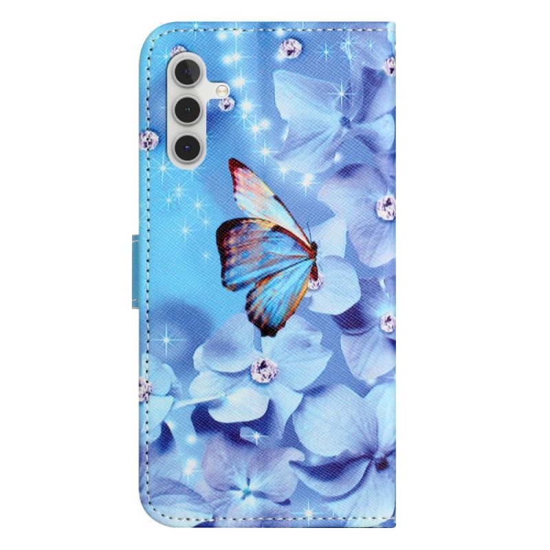 Lederhüllen Samsung Galaxy S24 Fe Blaue Blumen Und Schmetterlinge Mit Riemen