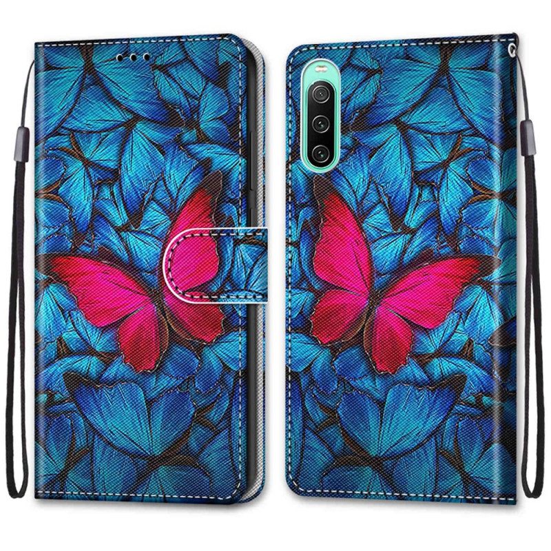 Flip Case Für Sony Xperia 10 IV Roter Schmetterling. Blauer Hintergrund