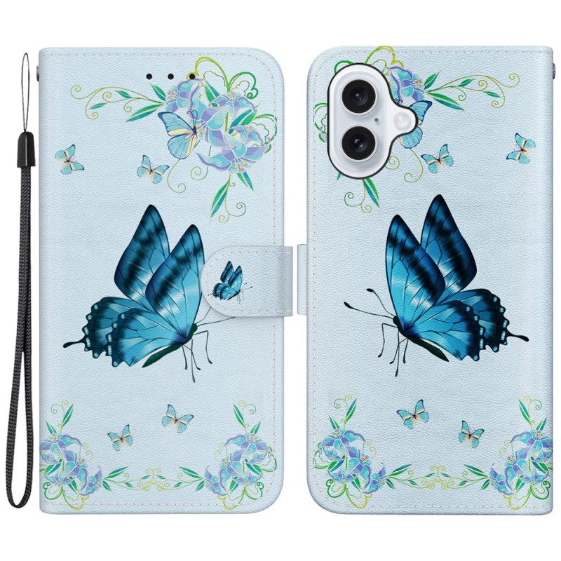 Lederhüllen iPhone 16 Blauer Schmetterling Und Blumen Mit Riemen