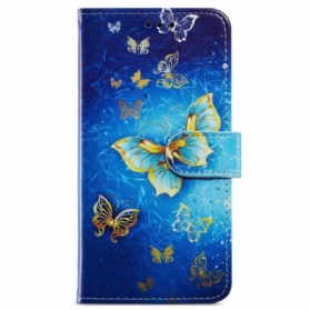 Lederhüllen Samsung Galaxy A55 5g Goldener Schmetterling Auf Blauem Hintergrund Mit Riemen